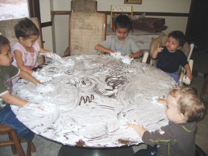 All Five Kids Cleaning the Table